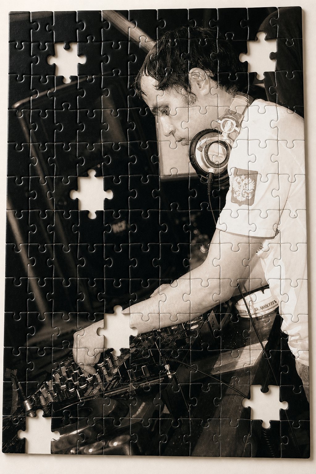 Use the uploaded photo as the base.
Turn the image into a realistic jigsaw puzzle. The whole photo should appear printed on puzzle pieces with visible interlocking cut lines across the entire image.
Remove several puzzle pieces in different areas so there are clean empty gaps showing a white or very light background underneath. Keep the person, face, pose, proportions, clothing, and composition recognizable and unchanged.
Add subtle 3D depth, soft shadows, and realistic puzzle-piece edges so it looks like a real physical puzzle. Keep the result photorealistic, stylish, and clean. No text, no watermark, no anatomy distortion, no illustration effect.